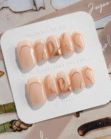 Poetic Glamour Nude press-on nails in short square shape — nude french tip gold line