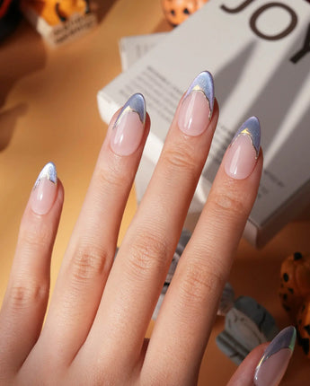 Polaris chrome French press on nails, nude base with an icy blue silver tip and a gold hand-drawn line - image 1