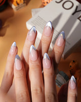 Polaris chrome French press on nails, nude base with an icy blue silver tip and a gold hand-drawn line - image 4