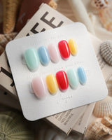 Popsicle short oval press-on nails with a bold frozen treat color palette