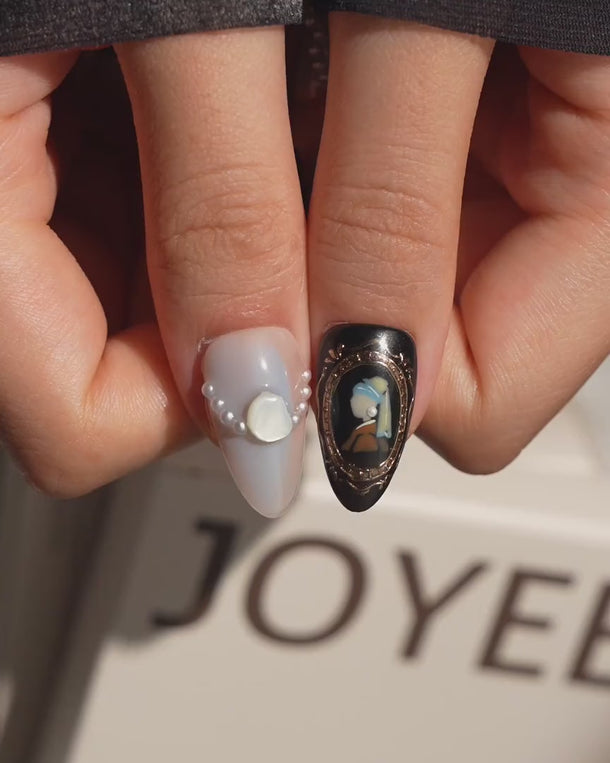Pearl Earring press on nails video with a gold-framed portrait and pearls, inspired by Vermeer