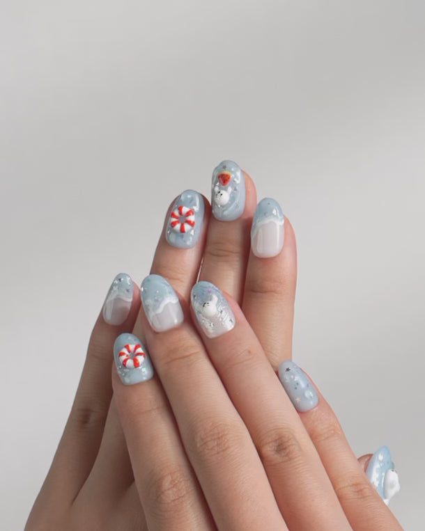 Press-on nails with hand-sculpted seal and waves	
