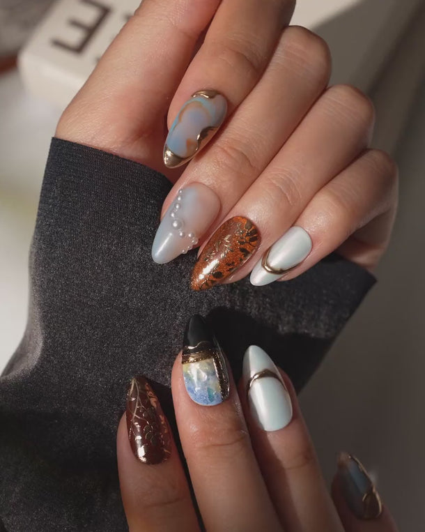 Pearl Earring press on nails video with a gold-framed portrait and pearls, inspired by Vermeer
