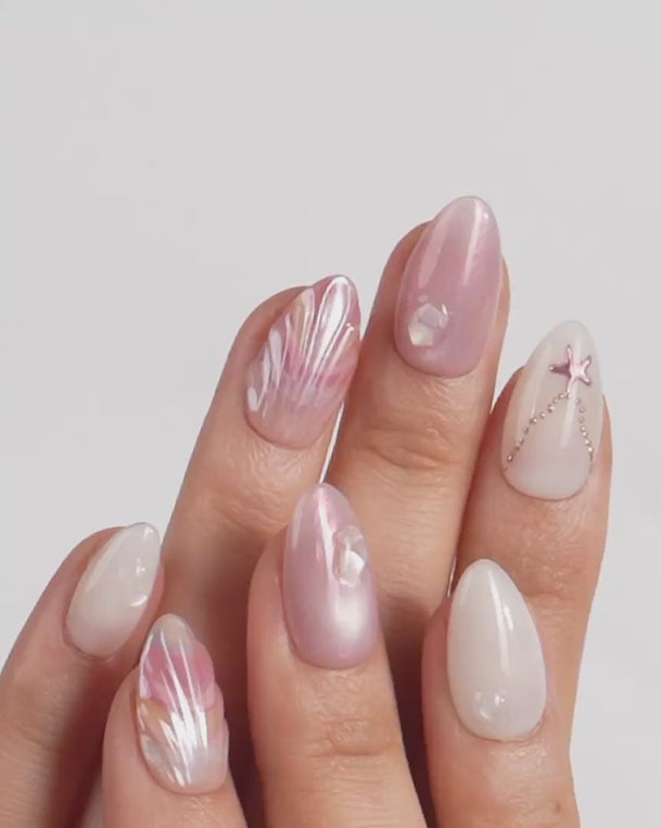Pink Treasure video of marble shell press-on nails with silver charms