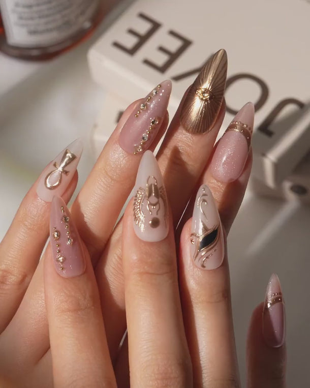 Egyptian Gold press on nails video with 3D gold sun, scarab and ankh on nude base