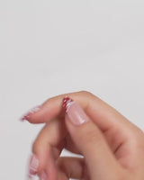 Coquette Dot video of lace-trimmed red polka dot French press-on nails