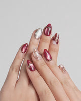 Coquette Red press-on nails video with red chrome, gold bows, roses and rhinestone details