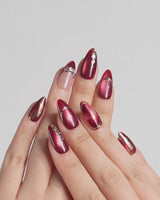 Molten Rouge press-on nails video with deep red cat-eye, gold outlines and crystal accents