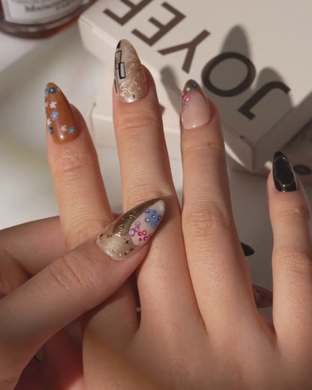 Golden Kiss press on nails video with raised gold spirals and flowers, inspired by Klimt
