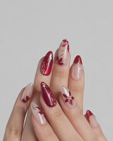 Crimson Petals press-on nails video with deep red French tips and gold floral details