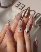Egyptian Gold press-on nails video showing raised gold symbols and crystal accents