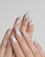 Snowfall press-on nails — pearl nude cat eye snowflake bow silver glitter soft sheen handmade nail art by Joyee Nails