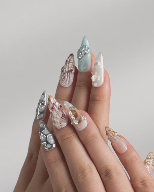 Blue and nude gradient seashell nails