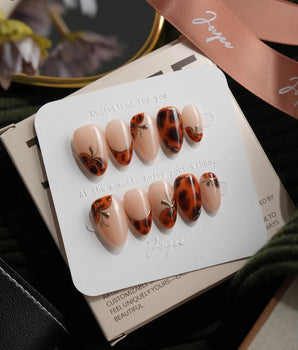 Pumpkin Patch almond press-on nails with warm brown tortoise nail art for fall