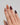 pumpkin tone press-on nails with wine red ends