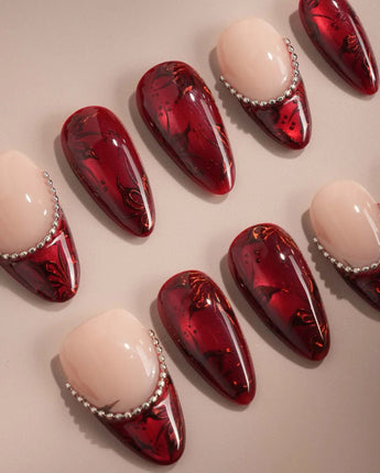 Red cat-eye press-on nails with carved texture