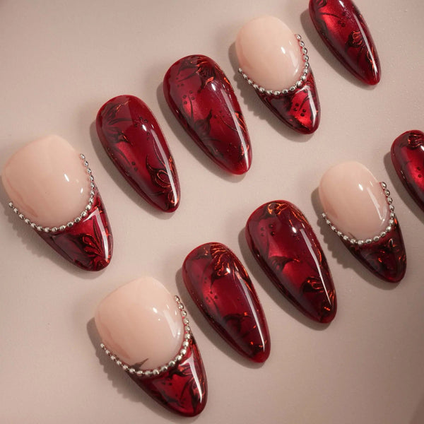 Red cat-eye press-on nails with carved texture