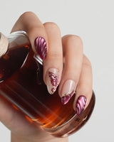 Velvet Flow press-on nails with deep berry red cat-eye gel and 3D butterfly wing details