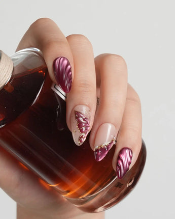 Velvet Flow press-on nails with deep berry red cat-eye gel and 3D butterfly wing details