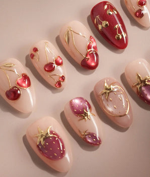 Crystal Berry handmade press-on nails featuring nude base red cat eye cherry gold outline 3D accents glossy finish