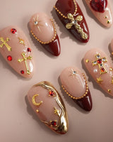 Gothic Red press-on nails with ornate 3D metallic crosses and deep burgundy red details