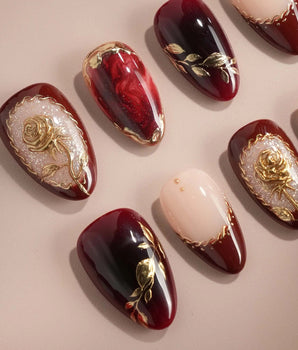 Gilded Merlot handmade press-on nails featuring deep red cat eye nude french gold rose relief gold foil glossy