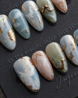 Renaissance Fresco XS press-on nails in short almond with angels, clouds and gold leaf