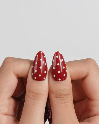 Retro Dot red polka dot nails with retro shine and balanced nude accents