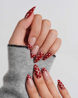 Retro Dot medium almond press-on nails with classic 1950s red polka dot style