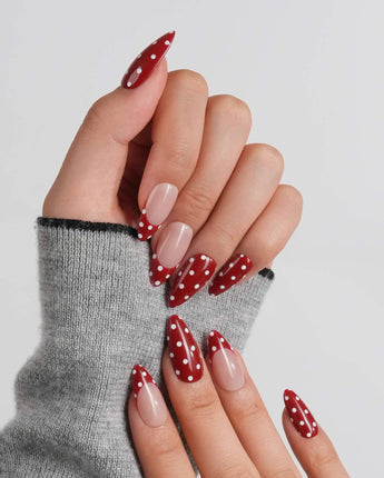 Retro Dot medium almond press-on nails with classic 1950s red polka dot style