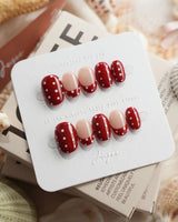 Retro Dot extra short oval nails with classic red dots and glossy nude contrast