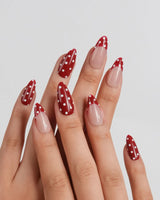 Retro Dot medium almond nails with deep wine red polish and white polka dots
