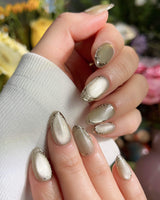 Ripples - Twinkle Reservoir handmade press-on nails featuring Premium Silver-Grey Cat Eye, French Metal Outlines.