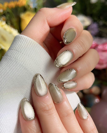 Ripples - Twinkle Reservoir handmade press-on nails featuring Premium Silver-Grey Cat Eye, French Metal Outlines.