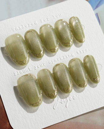 Ripples - Twinkle Reservoir press-on nails in medium oval shape — Premium Silver-Grey Cat Eye, French Metal Outlines.