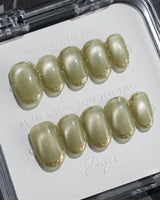Ripples - Twinkle Reservoir press-on nails in short oval shape — Premium Silver-Grey Cat Eye, French Metal Outlines.