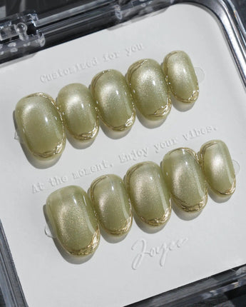 Ripples - Twinkle Reservoir press-on nails in short oval shape — Premium Silver-Grey Cat Eye, French Metal Outlines.