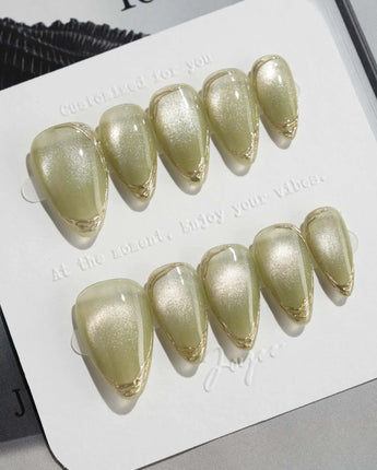 Ripples - Twinkle Reservoir press-on nails in short stiletto shape — Premium Silver-Grey Cat Eye, French Metal Outlines.