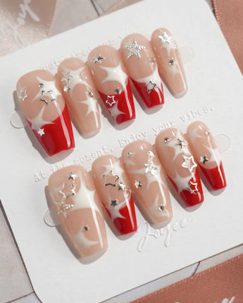 Rock Summer press-on nails in medium coffin shape — Red & White Star French, Silver Charms.