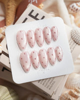Rose Bead medium almond nails with rose-gold bead dots and soft feminine shimmer