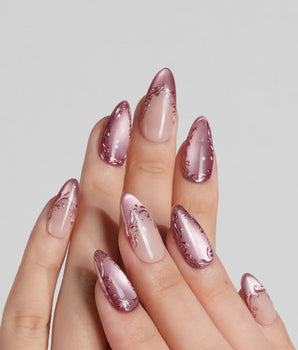 Rose Edge press-on nails with rose chrome tips, nude base and sculpted baroque swirl details