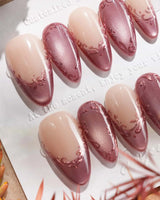 Rose Edge press-on nails with rose chrome French tips, nude base and 3D baroque swirls