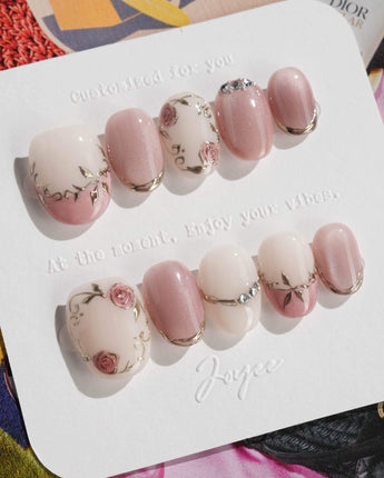 Rose-Théâtre Noir press-on nails in extra short oval shape — Elegant Rose Pink, Embossed Florals & Metallic Edging.