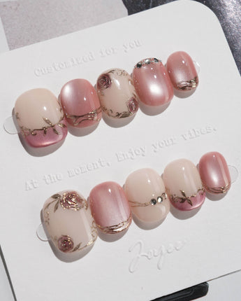 Rose-Théâtre Noir press-on nails in extra short squoval shape — Elegant Rose Pink, Embossed Florals & Metallic Edging.