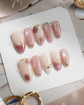 Rose-Théâtre Noir press-on nails in short almond shape — Elegant Rose Pink, Embossed Florals & Metallic Edging.