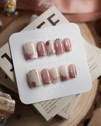 Rose-Théâtre Noir press-on nails in short square shape — Elegant Rose Pink, Embossed Florals & Metallic Edging.