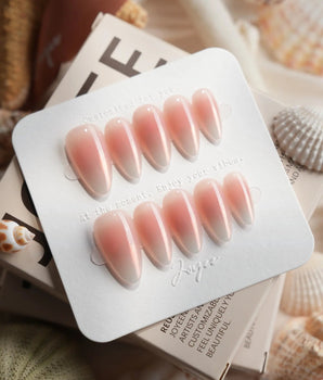 Rosy Glow glossy pink cat-eye nails with blush, champagne, and soft violet shift