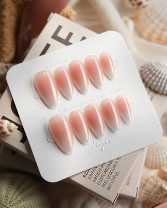 Rosy Glow glossy pink cat-eye nails with blush, champagne, and soft violet shift