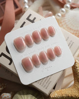 Rosy Glow pink aurora cat-eye press-on nails in extra short oval shape