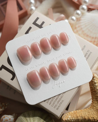 Rosy Glow pink aurora cat-eye press-on nails in extra short oval shape